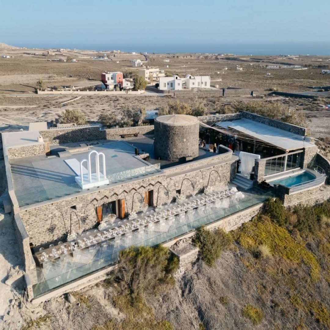 Aerial view of Cavo Ventus wedding venue on the caldera edge at Akrotiri, Santorini