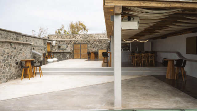 Covered stone terrace and bar area at Cavo Ventus, Akrotiri, Santorini