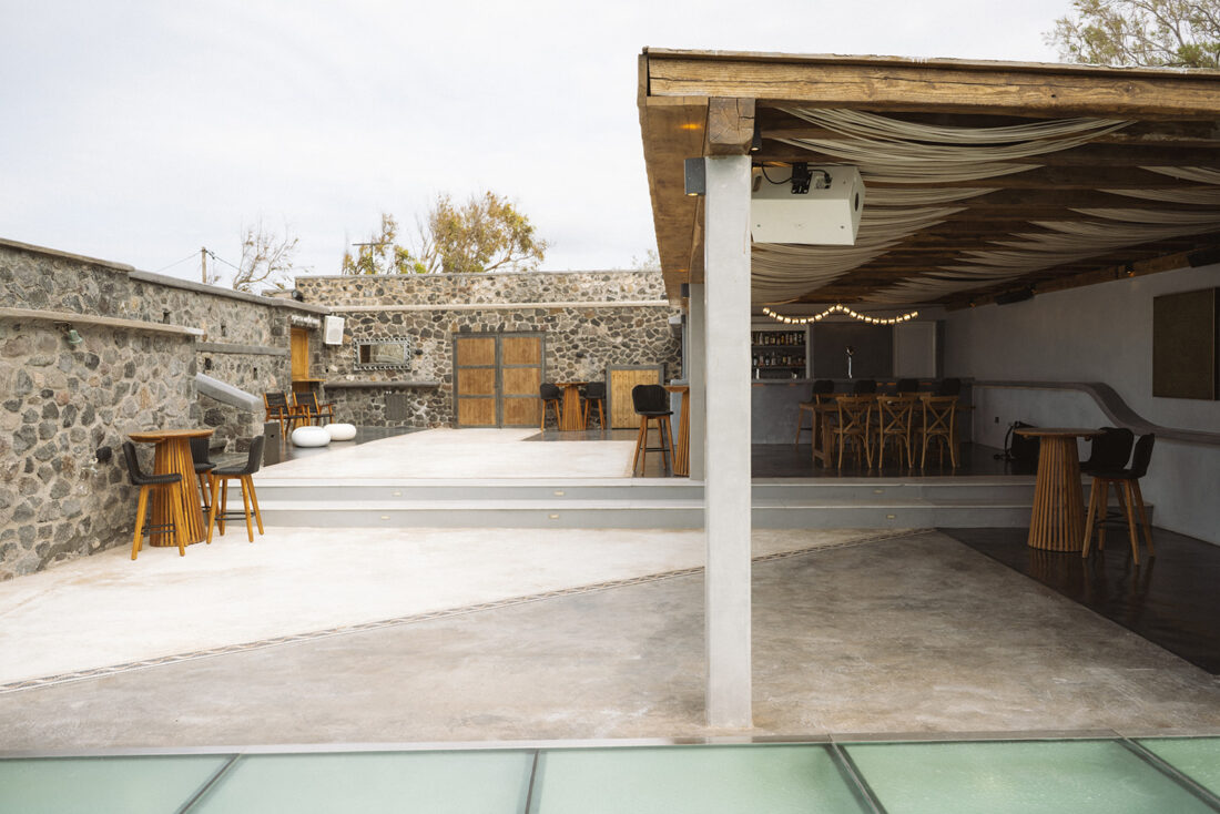 Covered stone terrace and bar area at Cavo Ventus, Akrotiri, Santorini
