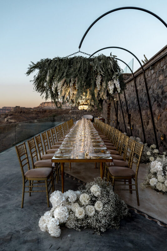 Ceremony arch and table setting overlooking the caldera at Cavo Ventus, Santorini