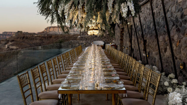 Ceremony arch and table setting overlooking the caldera at Cavo Ventus, Santorini