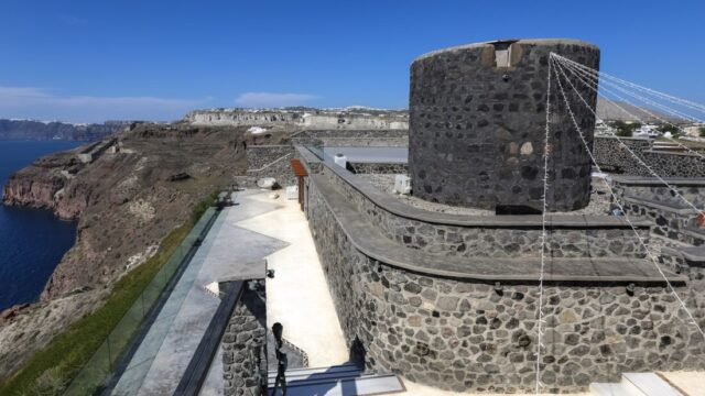 The restored 200 year old stone windmill at Cavo Ventus above the Santorini caldera