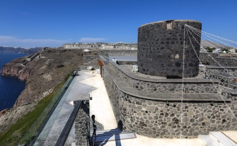 The restored 200 year old stone windmill at Cavo Ventus above the Santorini caldera