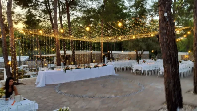 A canopy of fairy lights above the reception tables at Kaminari Village, Rhodes