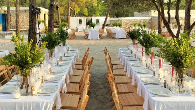 Table setting with red candles and olive branches at Kaminari Village, Rhodes