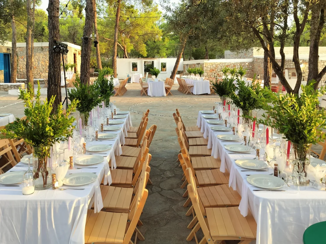 Table setting with red candles and olive branches at Kaminari Village, Rhodes