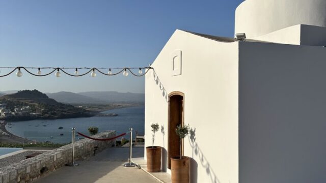 The whitewashed chapel and terrace at Ktima Lindos above Vlicha bay, Rhodes