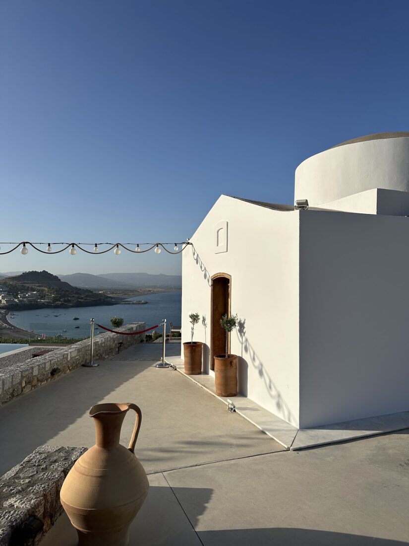 The whitewashed chapel and terrace at Ktima Lindos above Vlicha bay, Rhodes