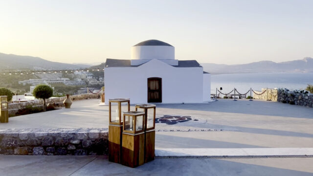 The whitewashed chapel with lanterns on the terrace at Ktima Lindos, Rhodes
