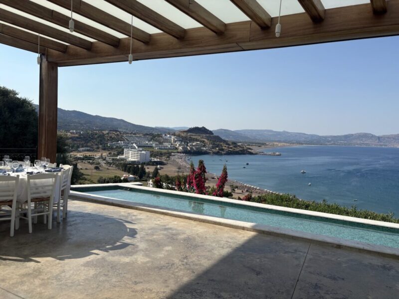 Pergola dining beside the infinity pool overlooking the bay at Ktima Lindos, Rhodes