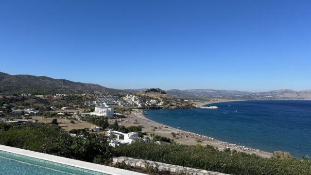 The infinity pool edge looking over Vlicha bay towards Lindos at Ktima Lindos