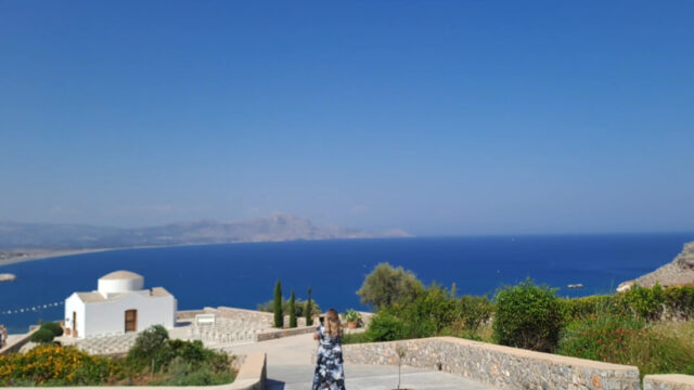 The chapel and terrace above the sea in daylight at Ktima Lindos, Rhodes
