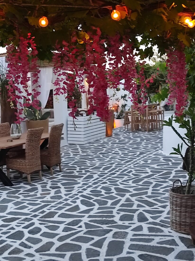 Walkway under hanging pink bougainvillea at Lythos wedding venue, Rhodes