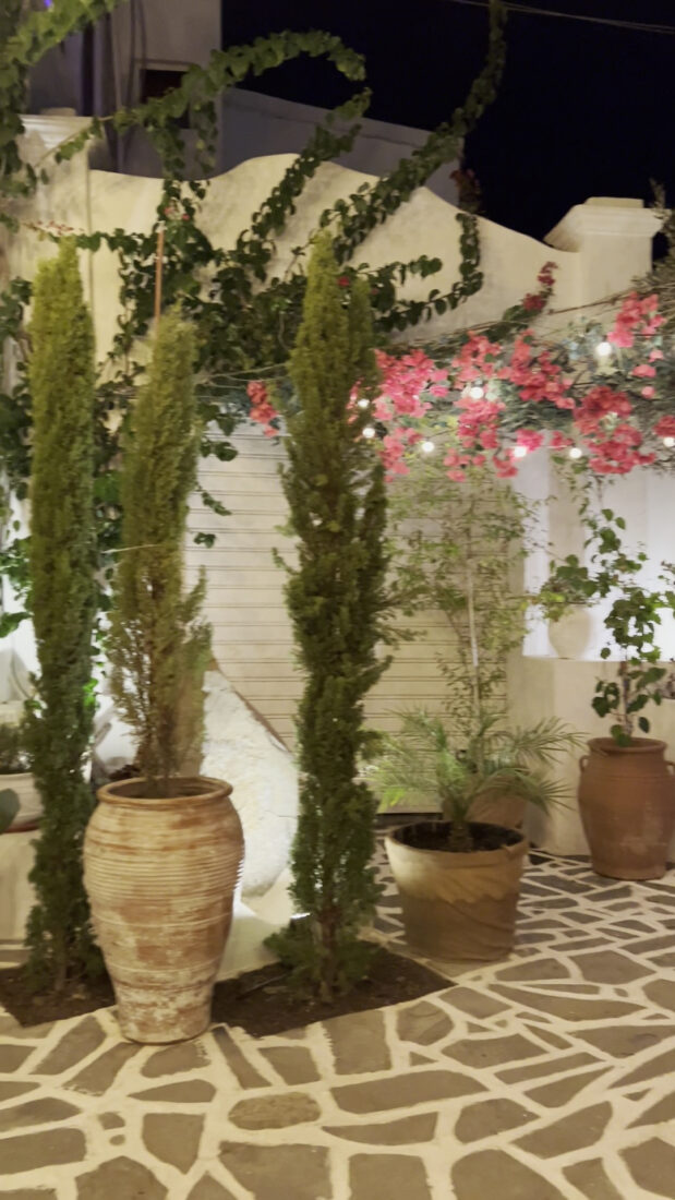 Whitewashed courtyard with bougainvillea and terracotta urns at Lythos, Rhodes