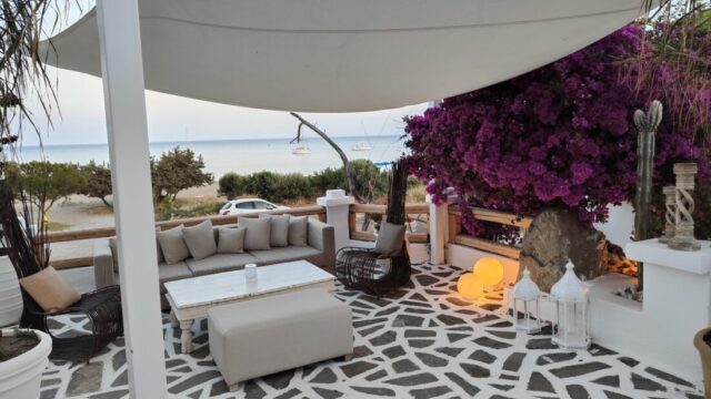 Shaded lounge terrace with bougainvillea at Lythos, Kiotari, Rhodes