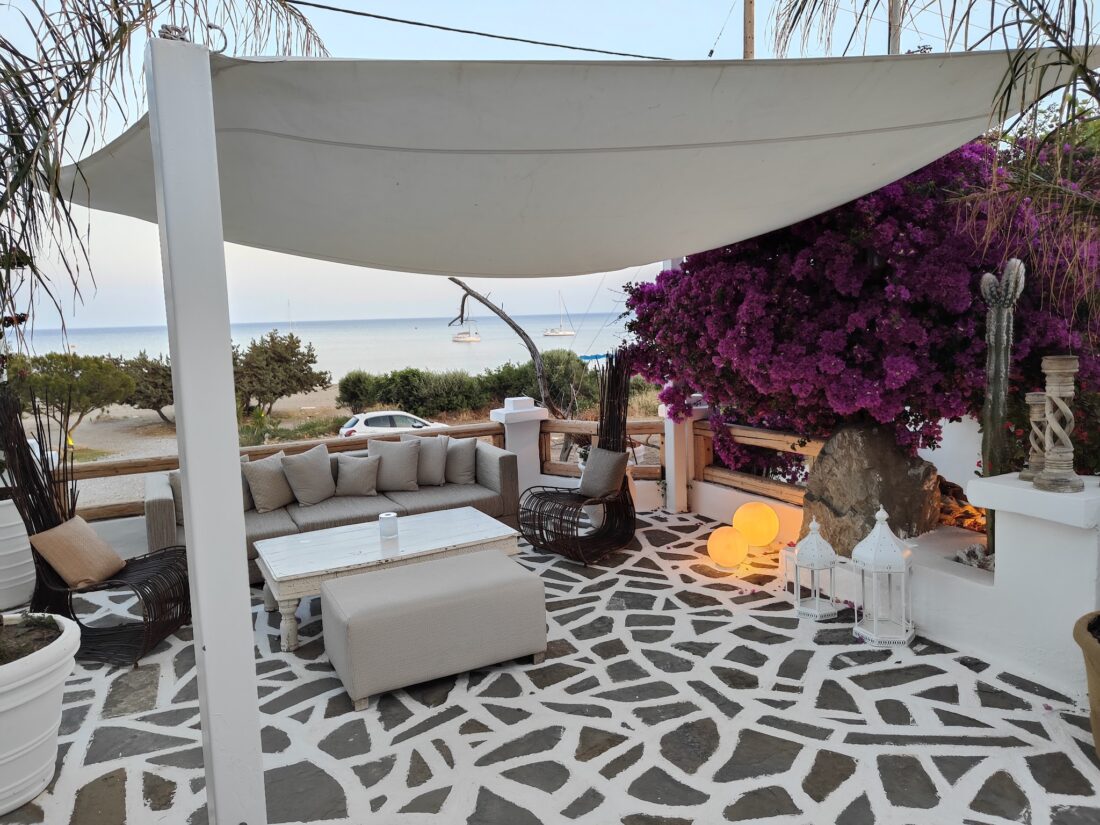Shaded lounge terrace with bougainvillea at Lythos, Kiotari, Rhodes