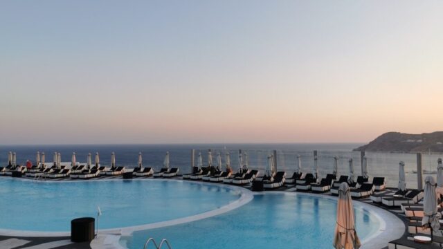 Sunset over the main pool at Royal Myconian, Elia Beach, Mykonos
