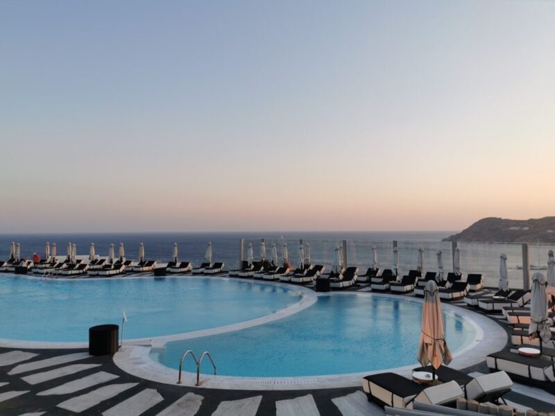 Sunset over the main pool at Royal Myconian, Elia Beach, Mykonos